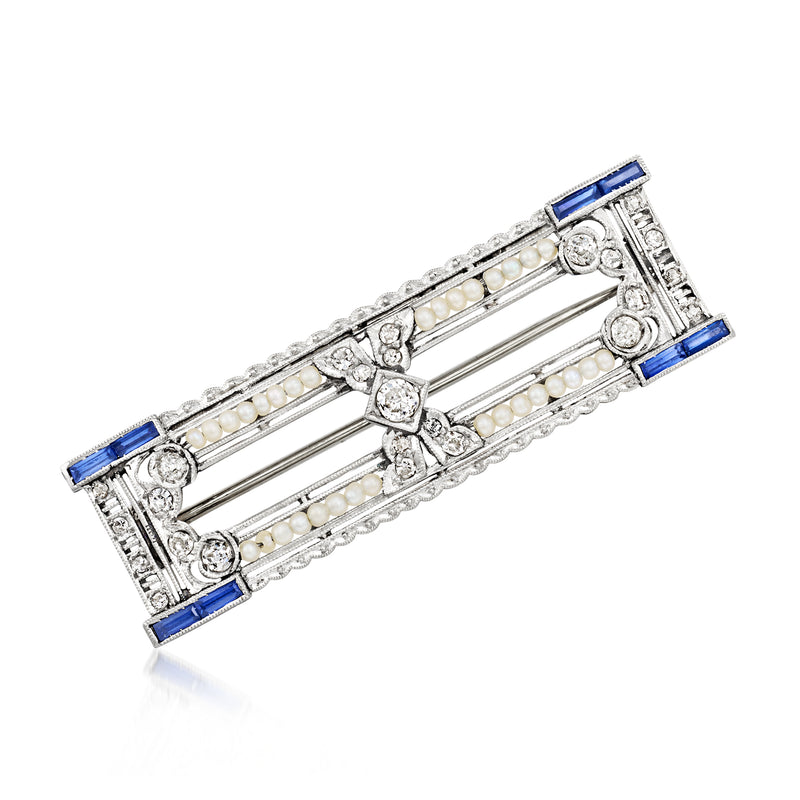 Vintage filigree bar pin with blue sapphire accents, seed pearls, and diamond-like stones