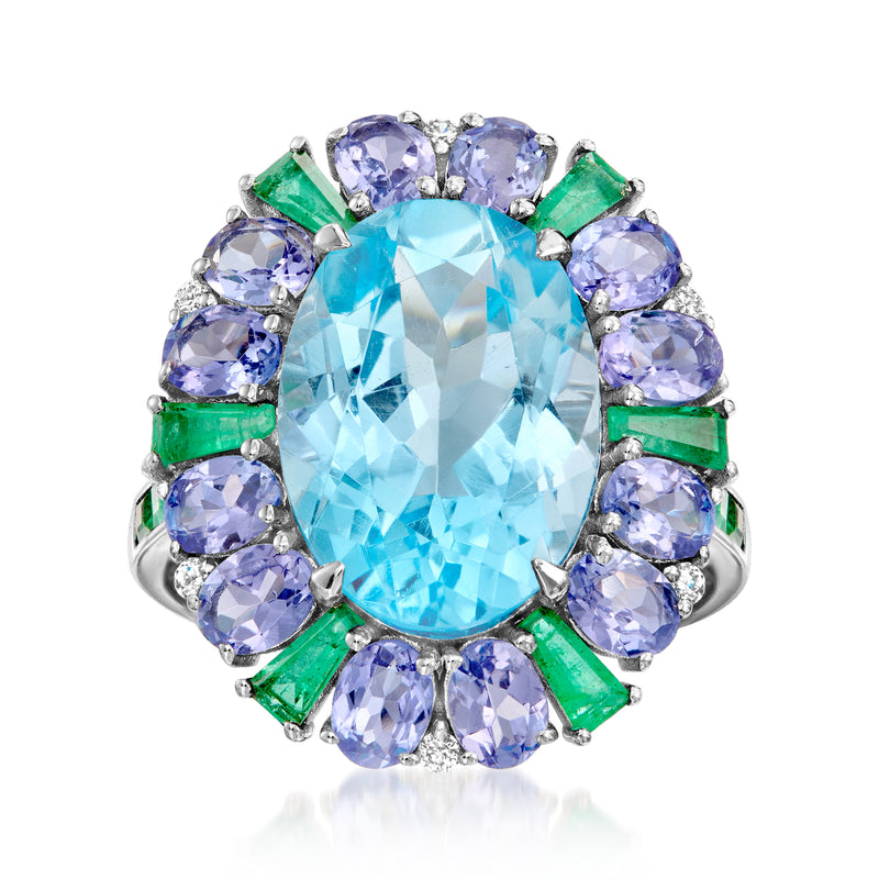 18k white gold ring: oval Swiss blue topaz with lavender halos and green stones