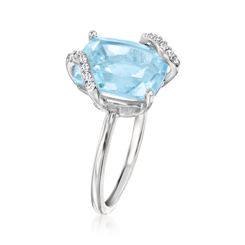 Sky blue topaz ring with prong setting and diamond halo on 14kt white gold band