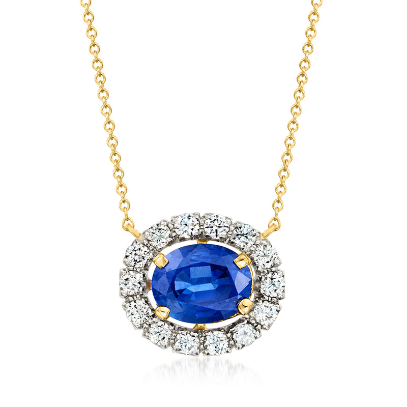 Two-tone gold sapphire and diamond pendant necklace with blue round center stone