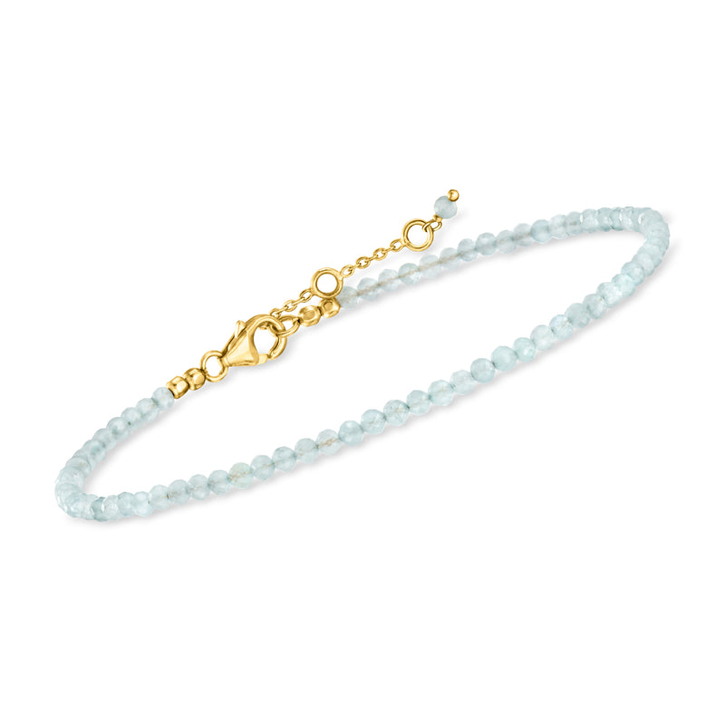 Aquamarine bead and gold link anklets displayed together with small clasp ends
