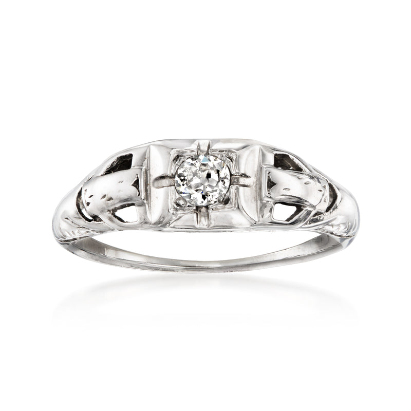 Vintage white gold diamond ring with round center stone in four prongs