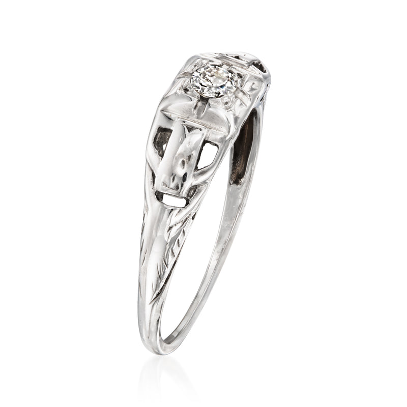 White gold diamond ring, side view showing raised setting and metal detailing