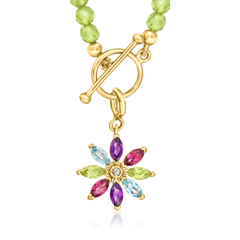 Gold flower charm with purple center teardrop and multicolor gemstone petals