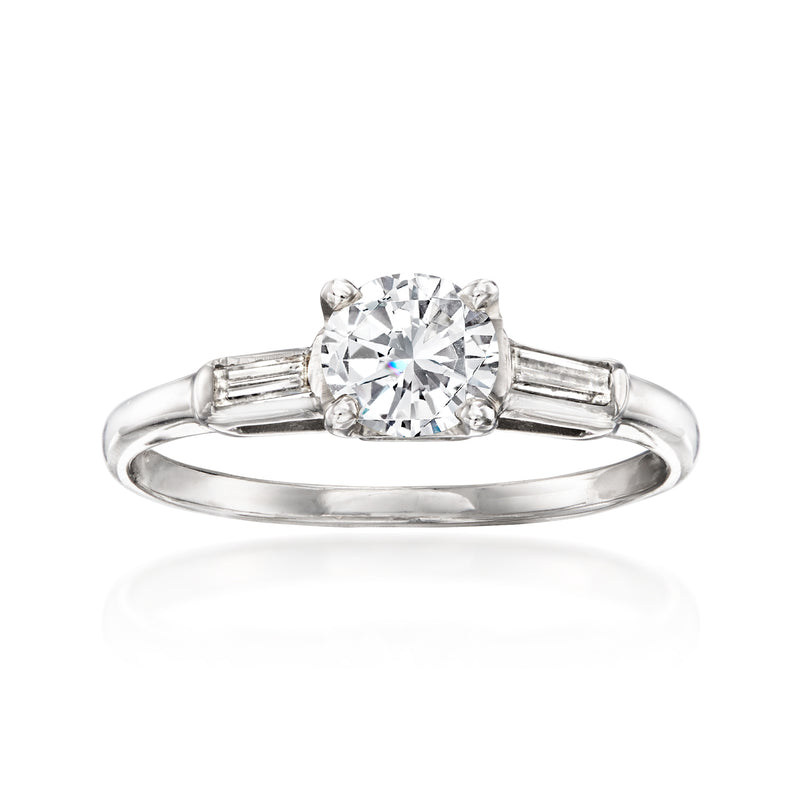 Round diamond solitaire ring in white gold with baguette-style side stones