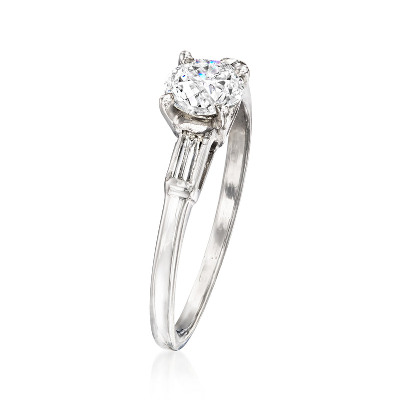 White gold ring with large round center diamond and slim baguette side stones