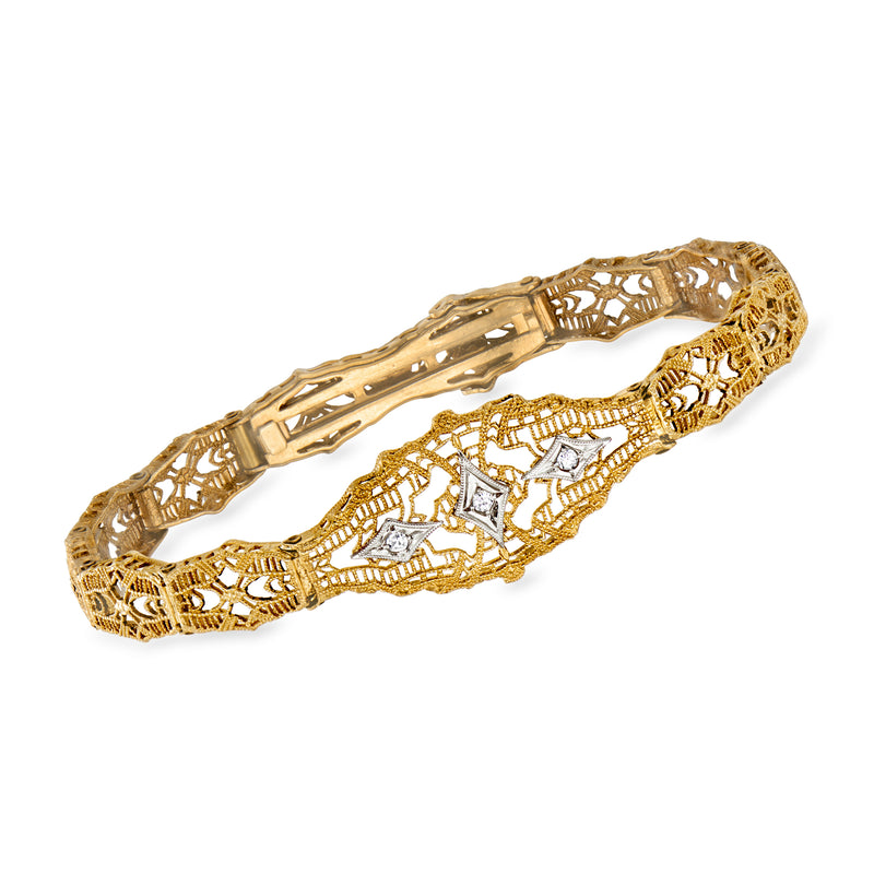 Two-tone 10kt gold filigree bracelet with openwork links and hinged cuff
