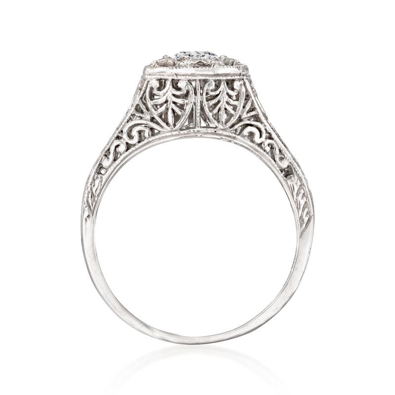 White gold filigree diamond ring with openwork bezel and round top setting