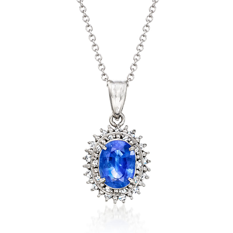 Platinum pendant necklace with oval blue sapphire center and diamond halo
