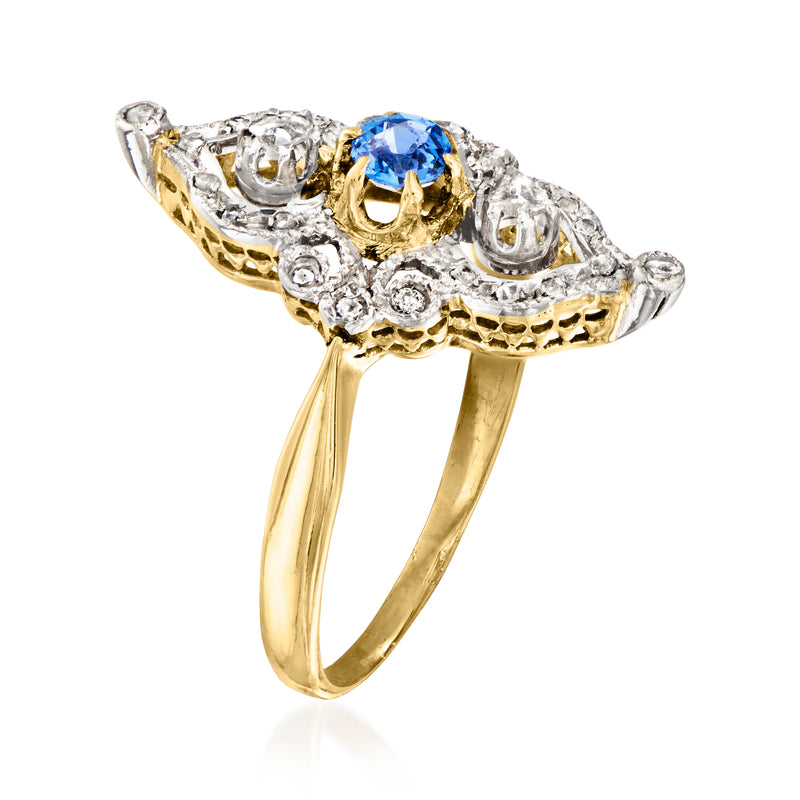 Vintage oval blue sapphire ring with diamond halo, yellow gold band and platinum details