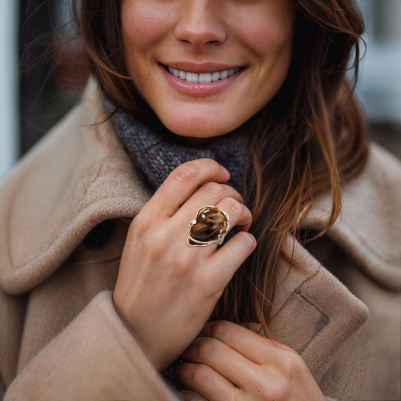 Tiger eye cat ring in 14kt yellow gold with diamond accents, worn on hand, size 6