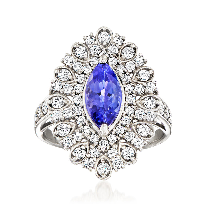Platinum vintage ring with oval blue gemstone center and diamond halo, size 5.5