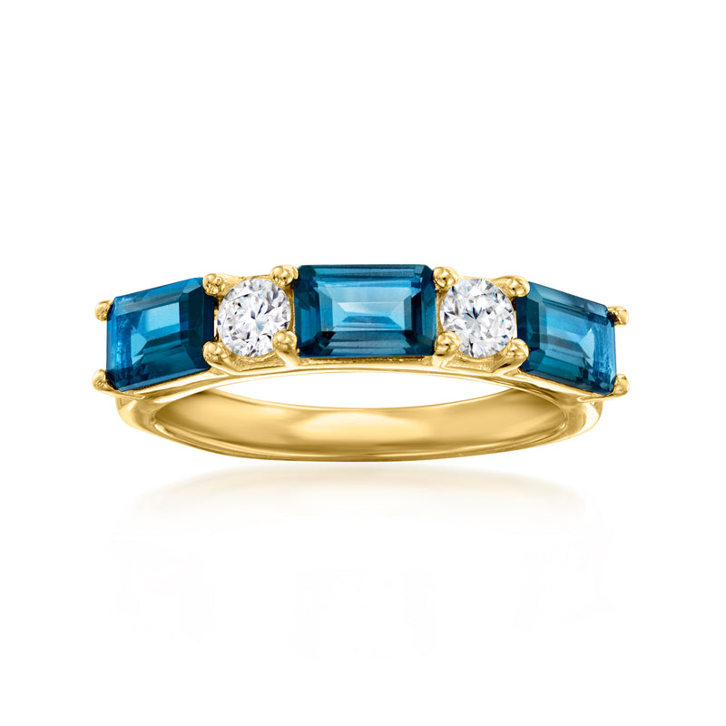 Gold ring with blue topaz baguettes and three round diamonds, prong-set