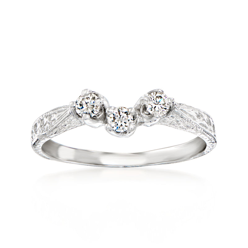 Platinum three-stone diamond ring with round center and two side stones, scalloped settings
