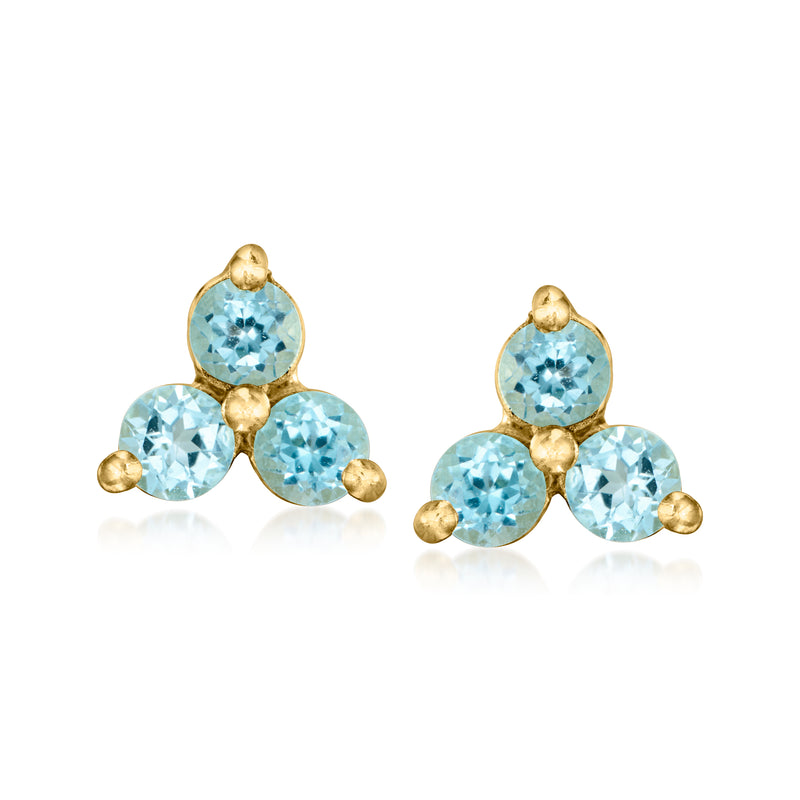 Blue gemstone stud earrings with three round stones on gold-tone posts