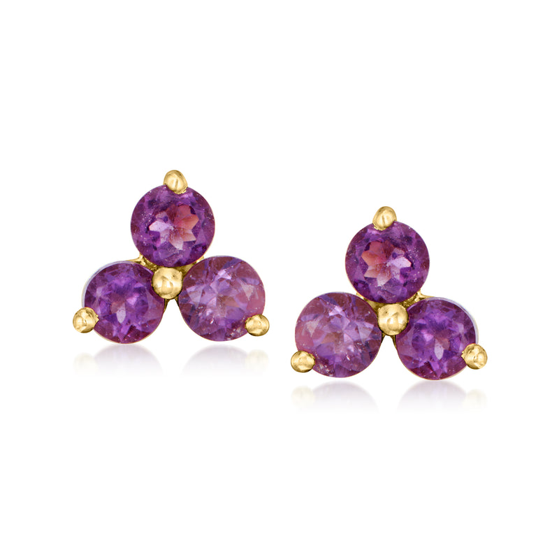 Purple gemstone stud earrings with three round stones on gold-tone posts