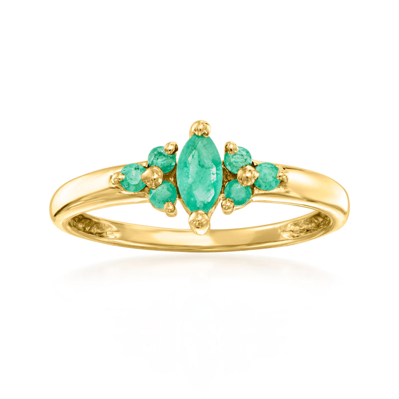 Vintage emerald and 18k yellow gold ring with oval center stone and four small green gems