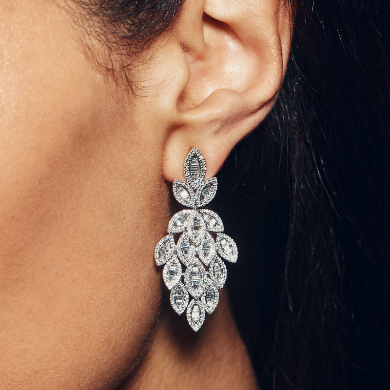 Diamond leaf drop earring in white gold, shown on ear