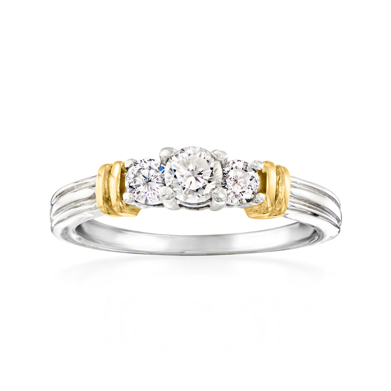 14kt two-tone gold three-stone diamond ring with round center and side stones