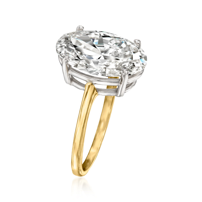 Two-tone 14kt gold oval solitaire ring with oval diamond in four-prong setting