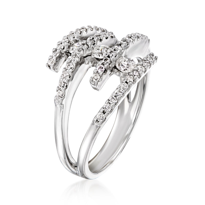 Vintage spiral diamond ring in 14kt white gold with arched top setting