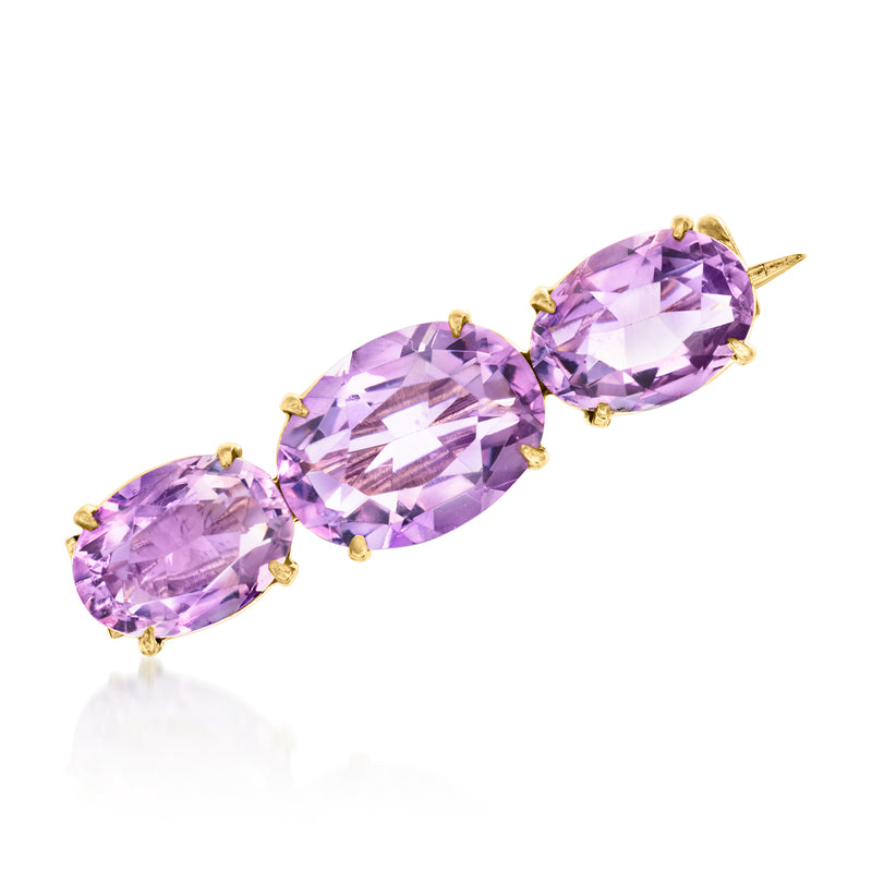 Vintage amethyst pin with three oval stones and gold prong settings