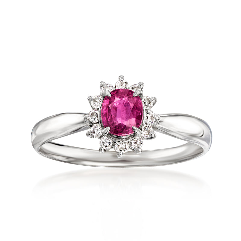 Platinum oval-cut ruby center ring with diamond halo and split-shank band