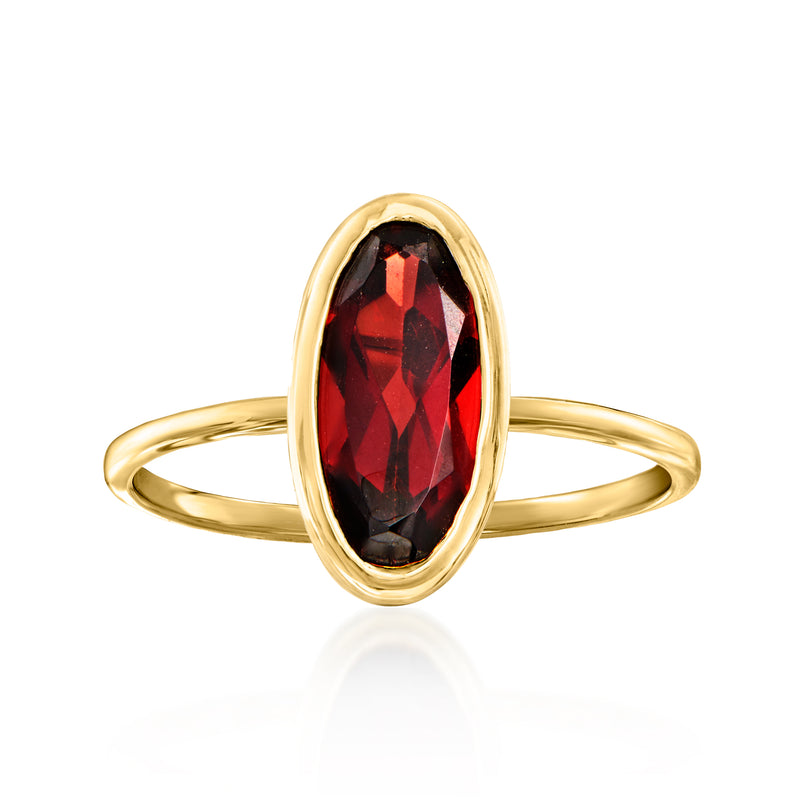 14kt yellow gold oval garnet ring with faceted red stone, bezel-set
