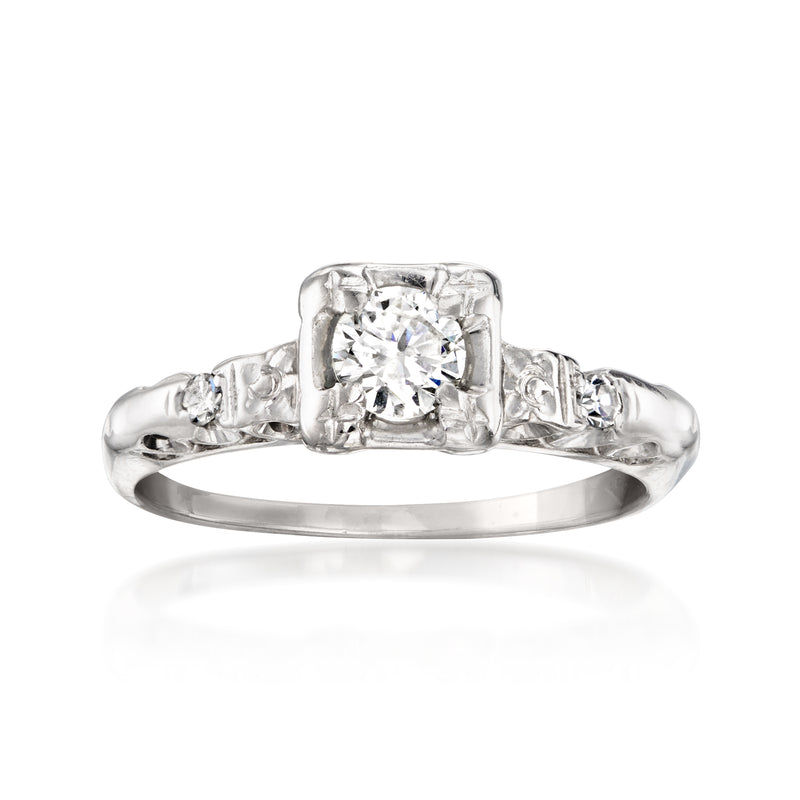 Vintage 14kt white gold diamond ring with round center stone and rectangular halo