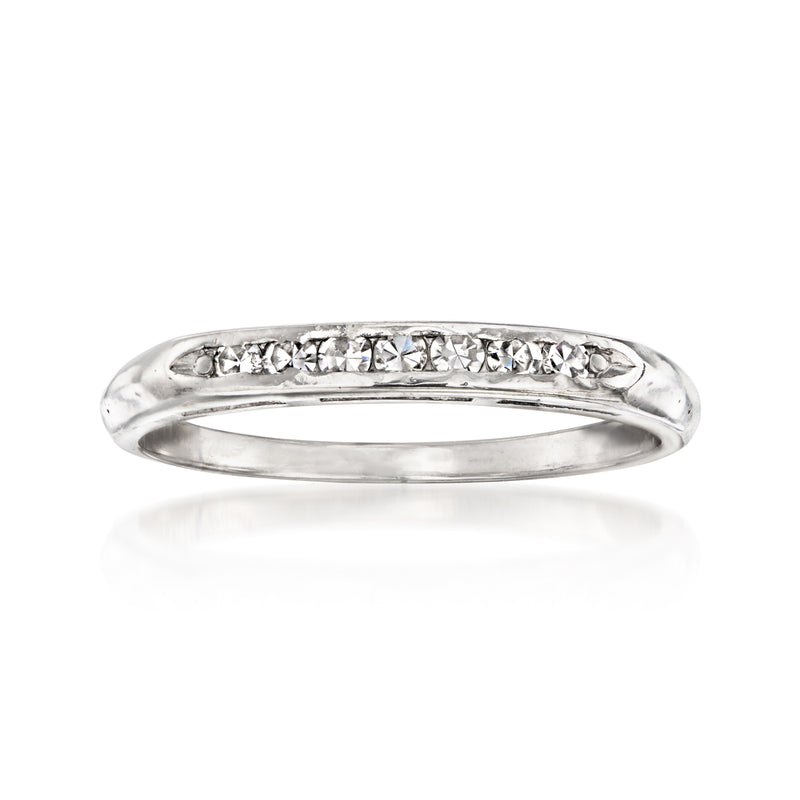 Vintage platinum diamond ring with prong-set stones across the top band