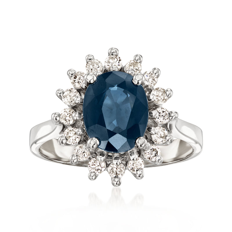 14kt white gold ring with oval blue sapphire and halo of round diamonds