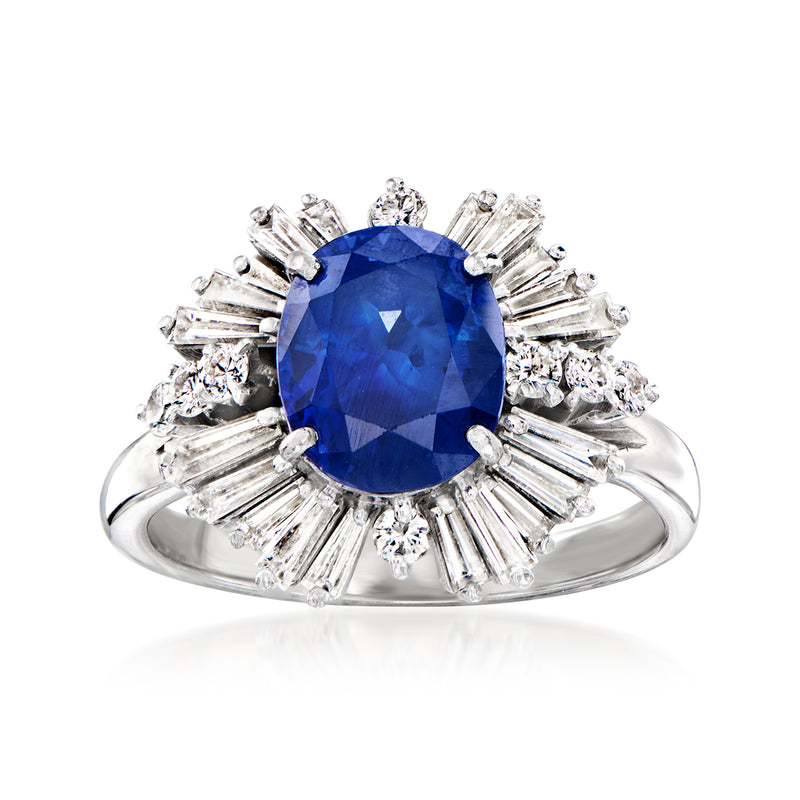 Platinum sapphire ring with oval blue center stone and diamond halo, side baguettes