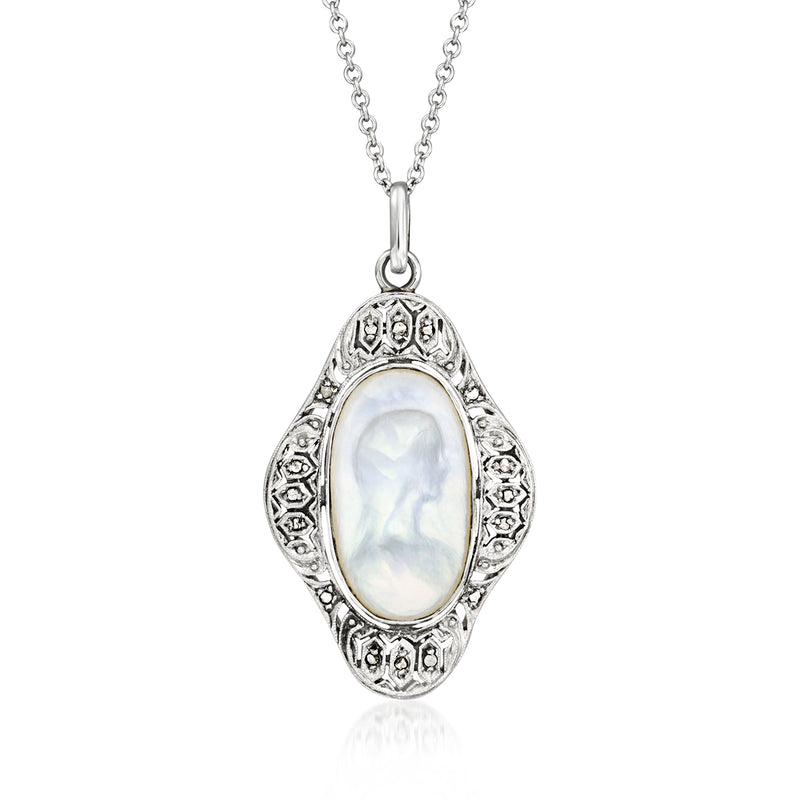 Vintage mother-of-pearl cameo pendant with diamond accents, silver-toned chain