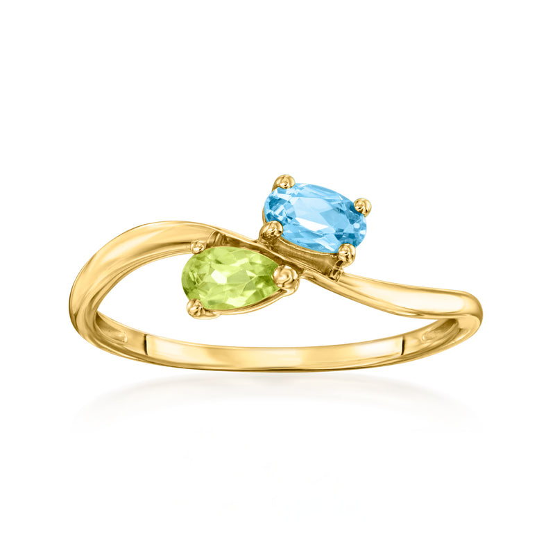14kt yellow gold bypass ring with green peridot and blue Swiss topaz gemstones