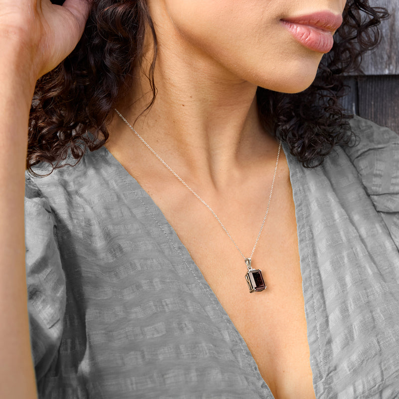 Smoky rectangular pendant necklace in sterling silver on fine chain, worn close-up
