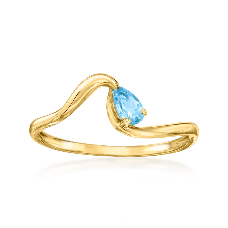 14kt yellow gold ring with oval blue topaz center stone