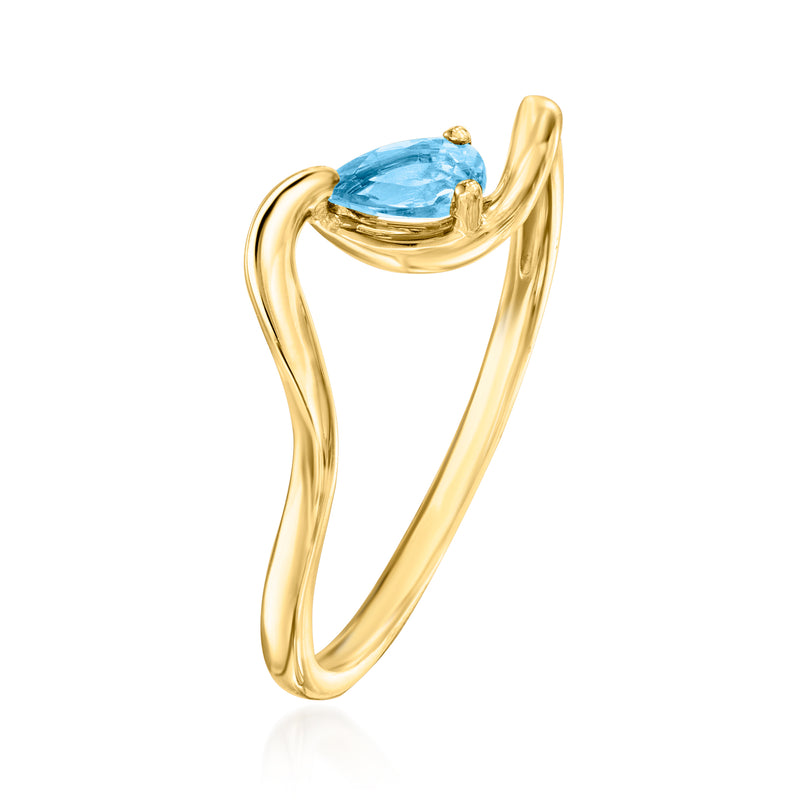 14kt yellow gold ring with raised oval blue topaz, slim curved band