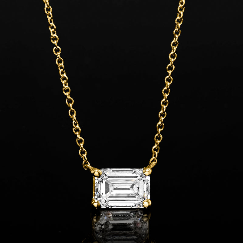 Yellow gold chain necklace with emerald-cut diamond solitaire pendant