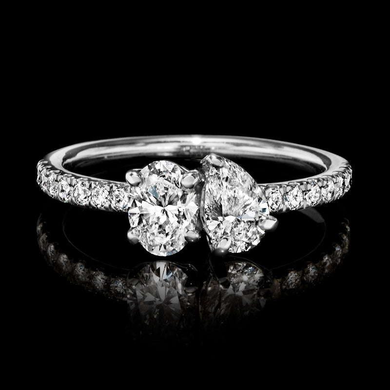 Toi et Moi diamond ring in white gold with two oval stones and pavé band
