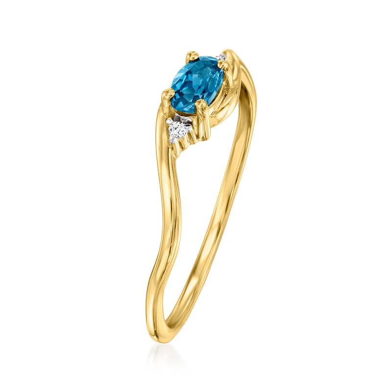 14kt yellow gold ring with large oval blue topaz center and diamond side stones