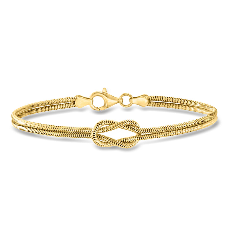 Gold-tone snake-chain bracelet with knot centerpiece and lobster clasp