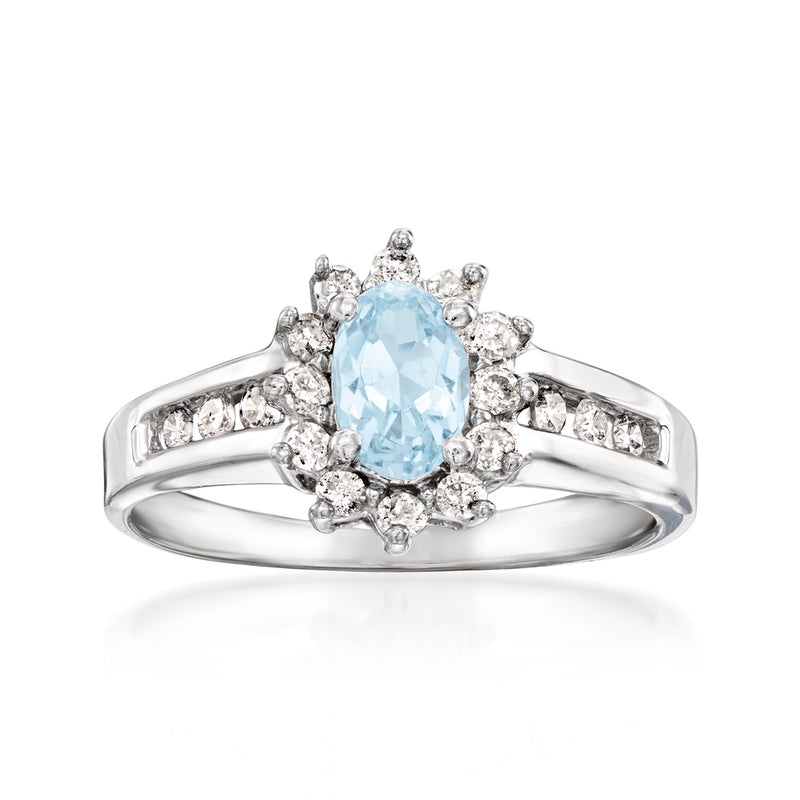 Vintage aquamarine oval ring with diamond halo, set in 10kt white gold