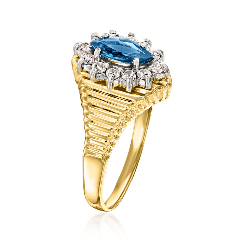 14kt yellow gold ring with marquise blue gemstone and round diamonds in halo