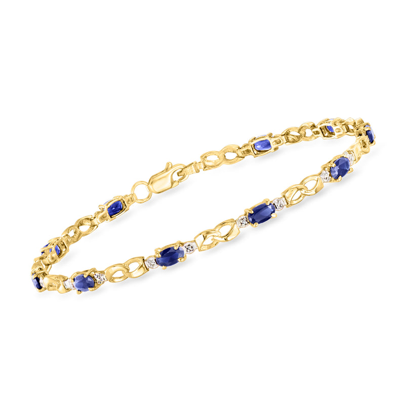 Two-tone gold tennis bracelet with blue sapphire oval stones and diamond accents