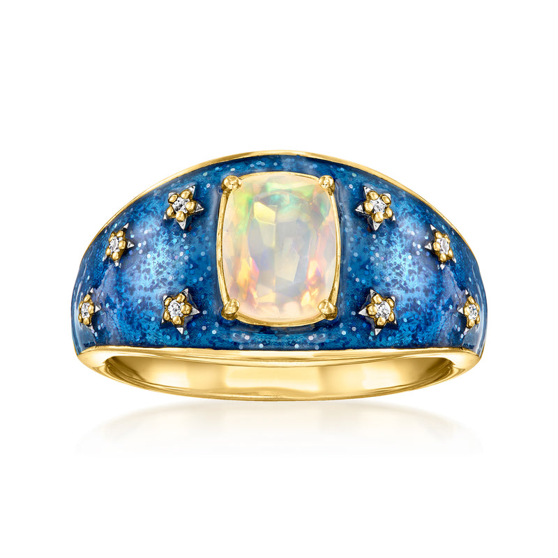 Gold-tone ring with blue glitter enamel, opal-like center stone, small star accents