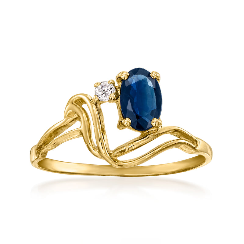 Vintage 10k yellow gold ring with oval sapphire center and small diamond accents