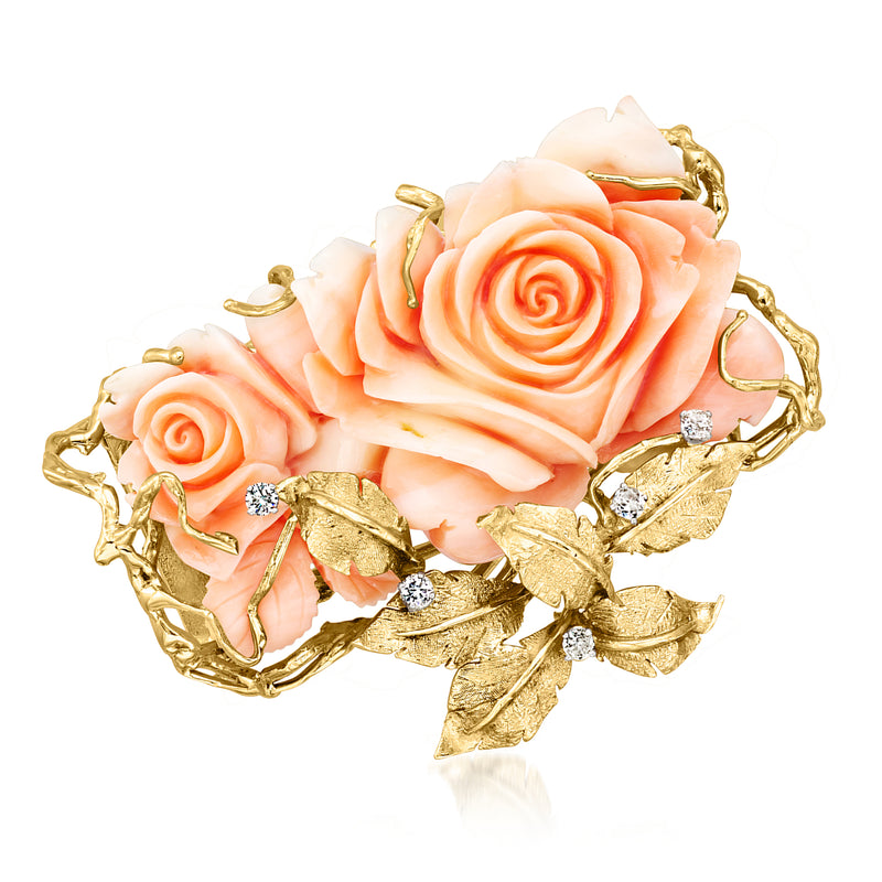 Gold floral pin with coral-pink roses, leaf filigree, and small diamond accents