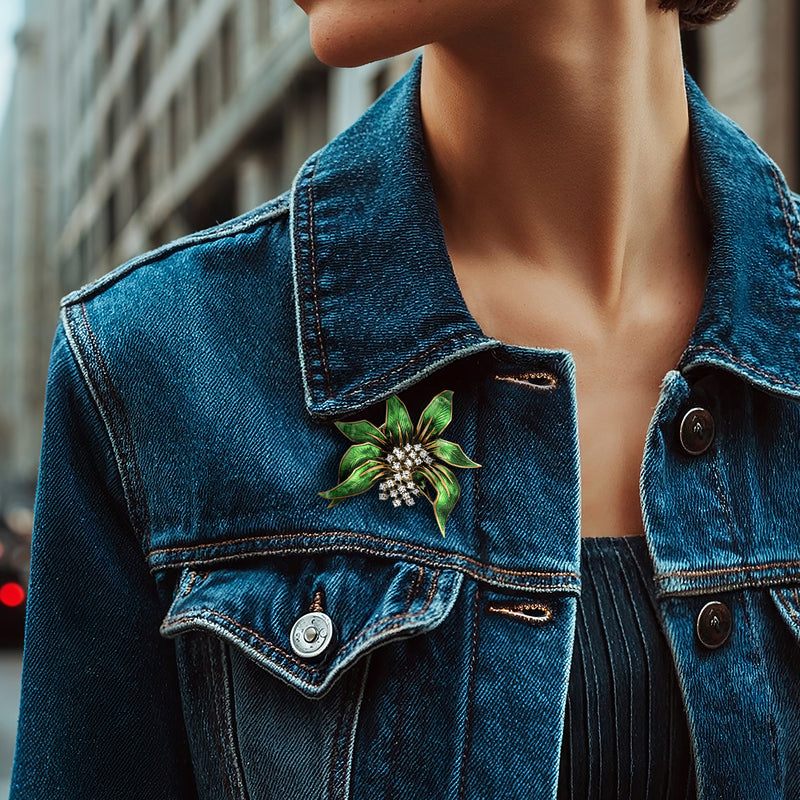 Diamond green enamel leaf pin on blue denim jacket collar