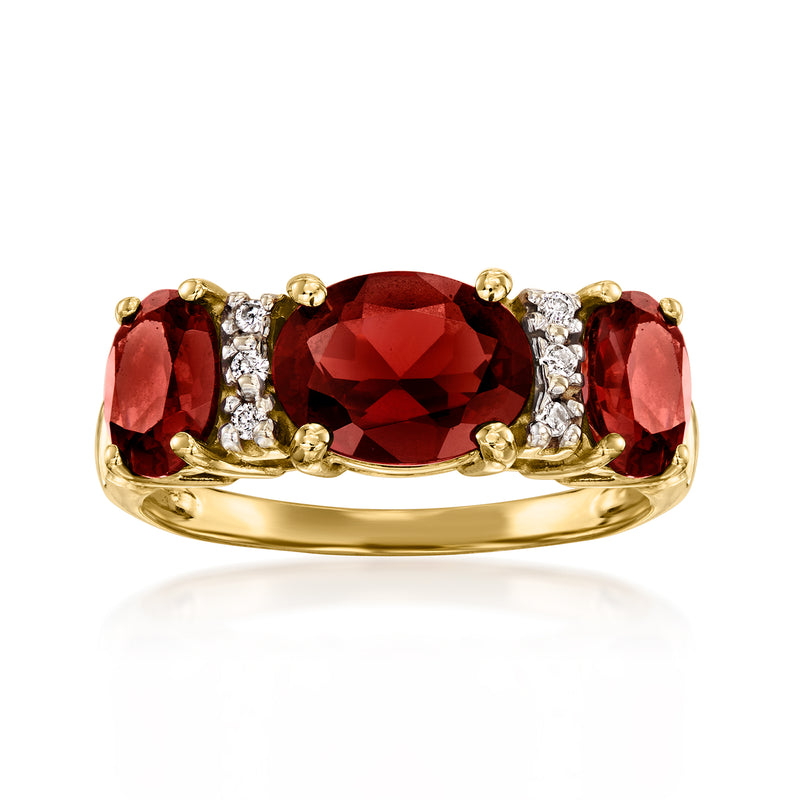14kt yellow gold ring with oval deep red garnet center and diamond accents
