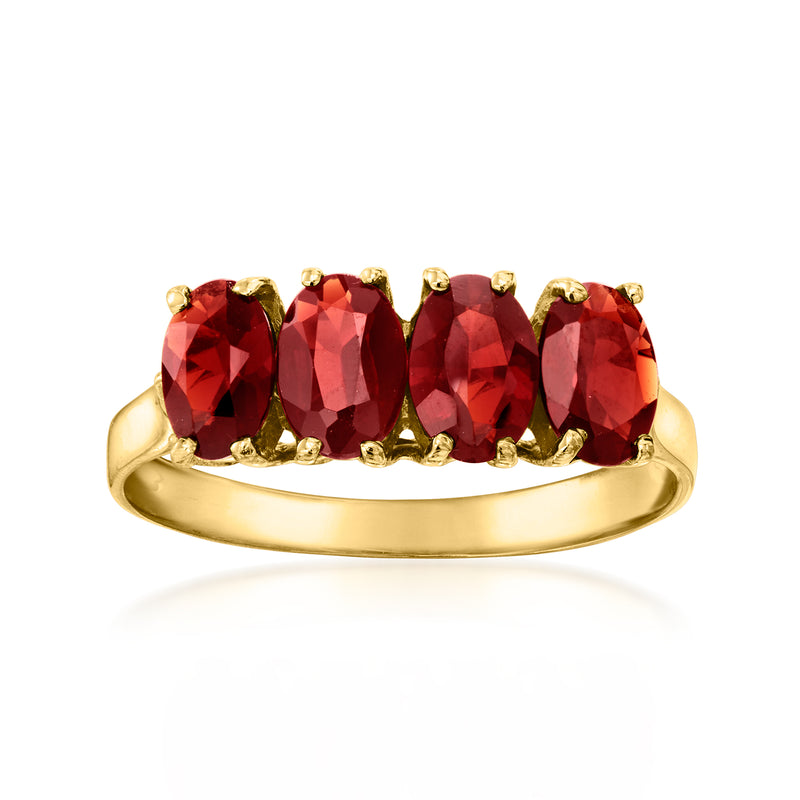 14kt yellow gold ring with four oval garnet gemstones in red, gold prong settings